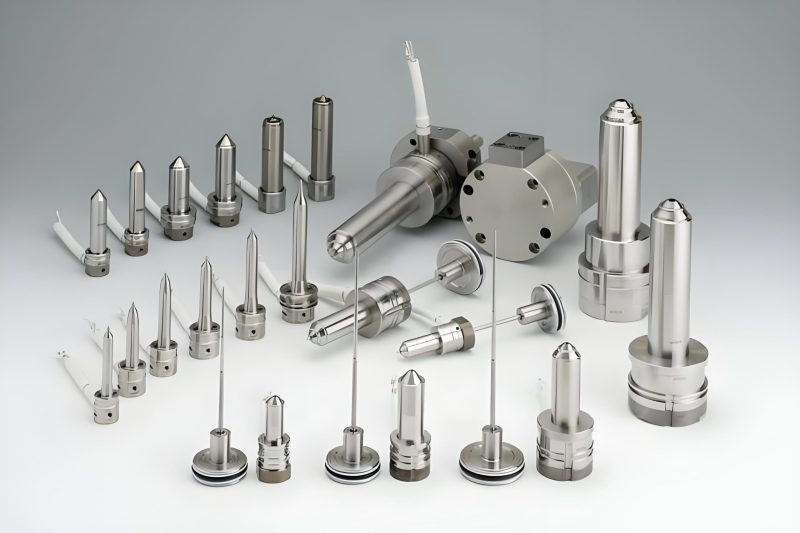 Exploded view of mold components showing various parts like cavity, core, ejector pins, and guide pillars