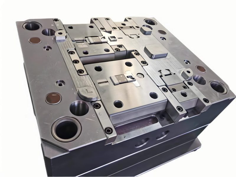 Detailed view of a plastic mold ejection system showing ejector pins, plates, and retainers